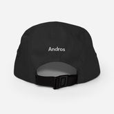 The backside of a black 5 panel hat